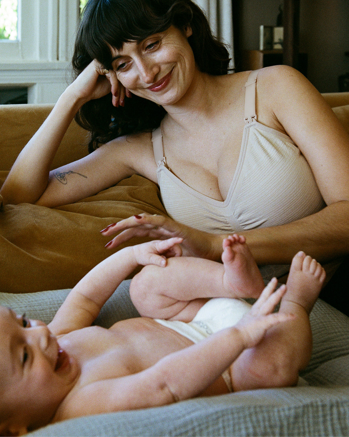 Model wearing the Sublime® Hands-Free Pumping & Nursing Bra in Beige.@model_info:Kayla is wearing a Small Busty.