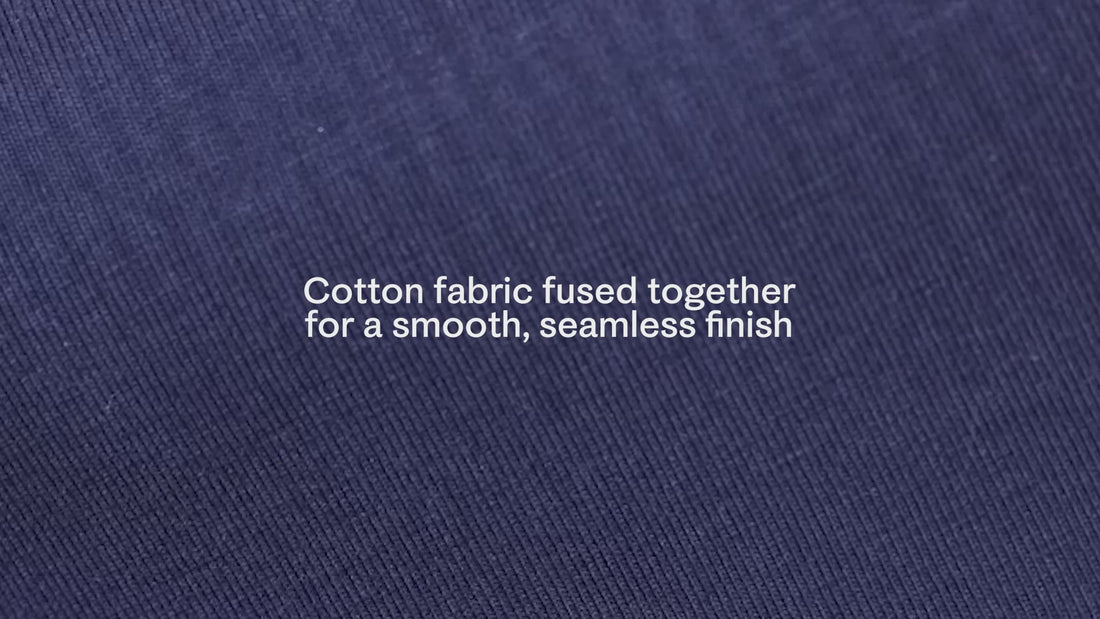 Short video of the stretchiness of the BareBond material, in Coastal Navy. White text reads, Cotton fabric fused together for a smooth, seamless finish.