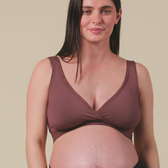 Video of model showing the fit on Every Stage Crossover Bra in Cocoa and Every Stage Brief in Black, on a beige background.