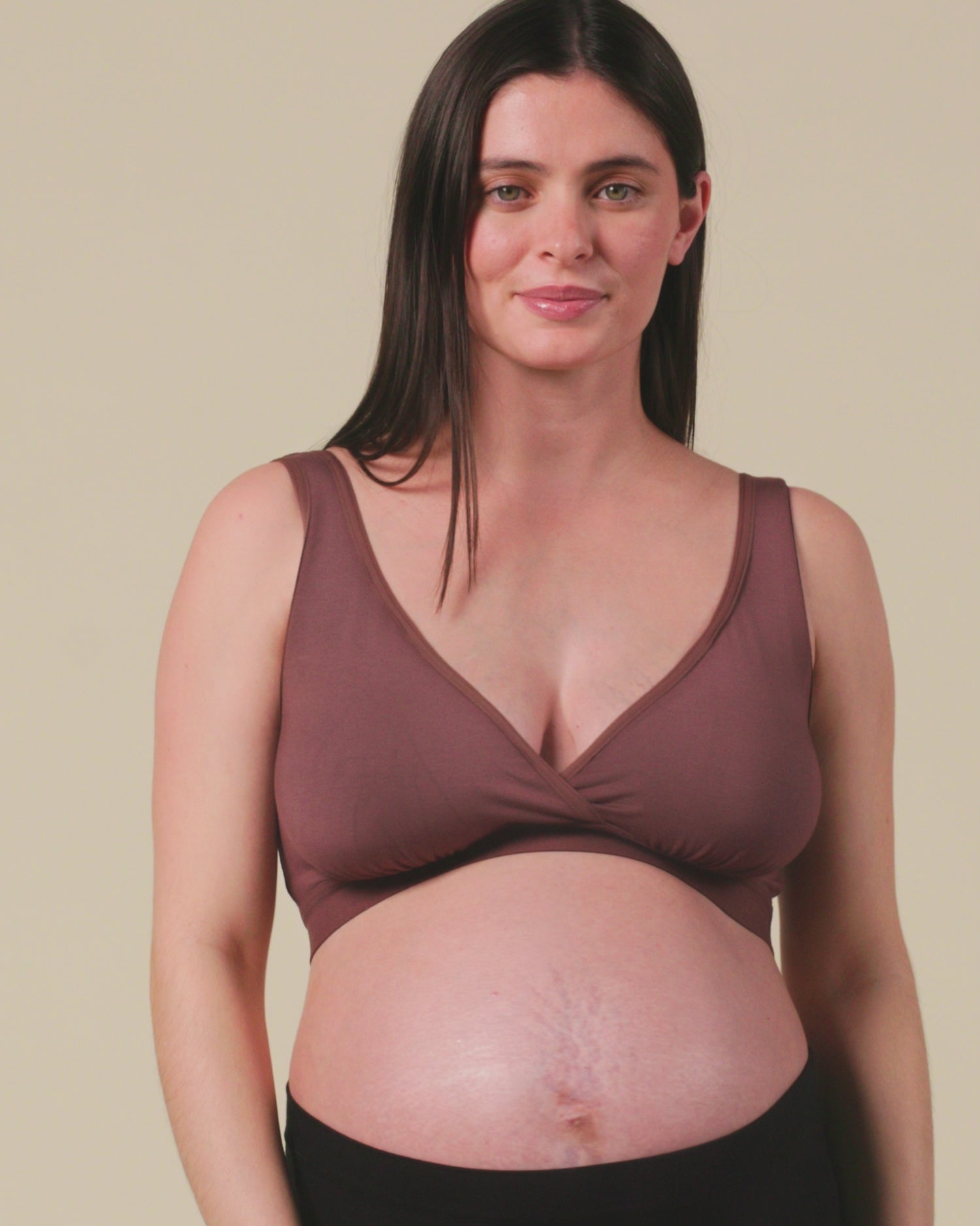 Video of model showing the fit on Every Stage Crossover Bra in Cocoa and Every Stage Brief in Black, on a beige background.