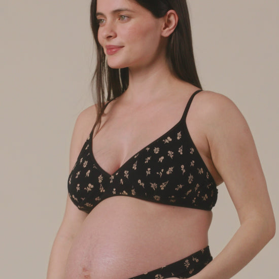 Video of model showing the fit on Every Stage Triangle Bralette in Black Wildflower and Every Stage Brief in Black Wildflower on a beige background