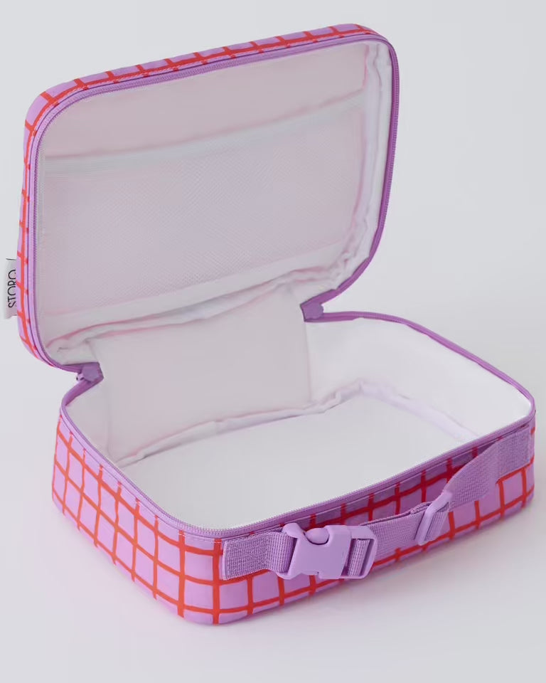 Video of six apples filling Cool Kid Lunch Box in Orchid Grid, on a beige background.