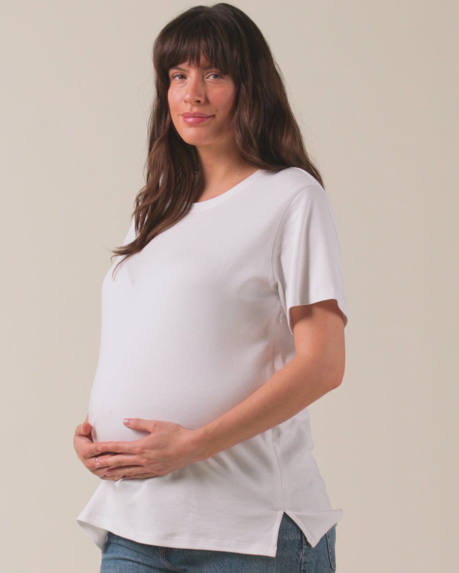 Video of model wearing Pima Cotton Side Zip Maternity & Nursing T-shirt in White with a neutral background