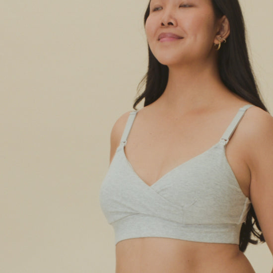 Video of model showing the fit on the SoftStretch Cotton Nursing Bra and SoftStretch Cotton Maternity & Postpartum Hipster in Grey Heather on a beige background. 