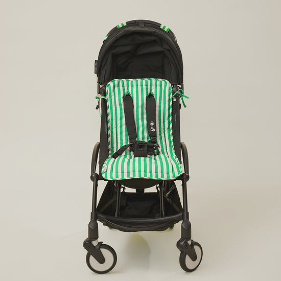 Stop motion video showing a stroller with the Stroller Party Seat Liner, Stroller Party Clips and Stroller Party Caddy Bag in Green Stripe