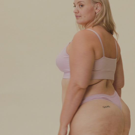 Video of model showing soft fit on the SoftStretch Cotton Nursing Bra in Lilac Mist and SoftStretch Cotton Maternity & Postpartum Thong in Lilac Mist on a beige background.