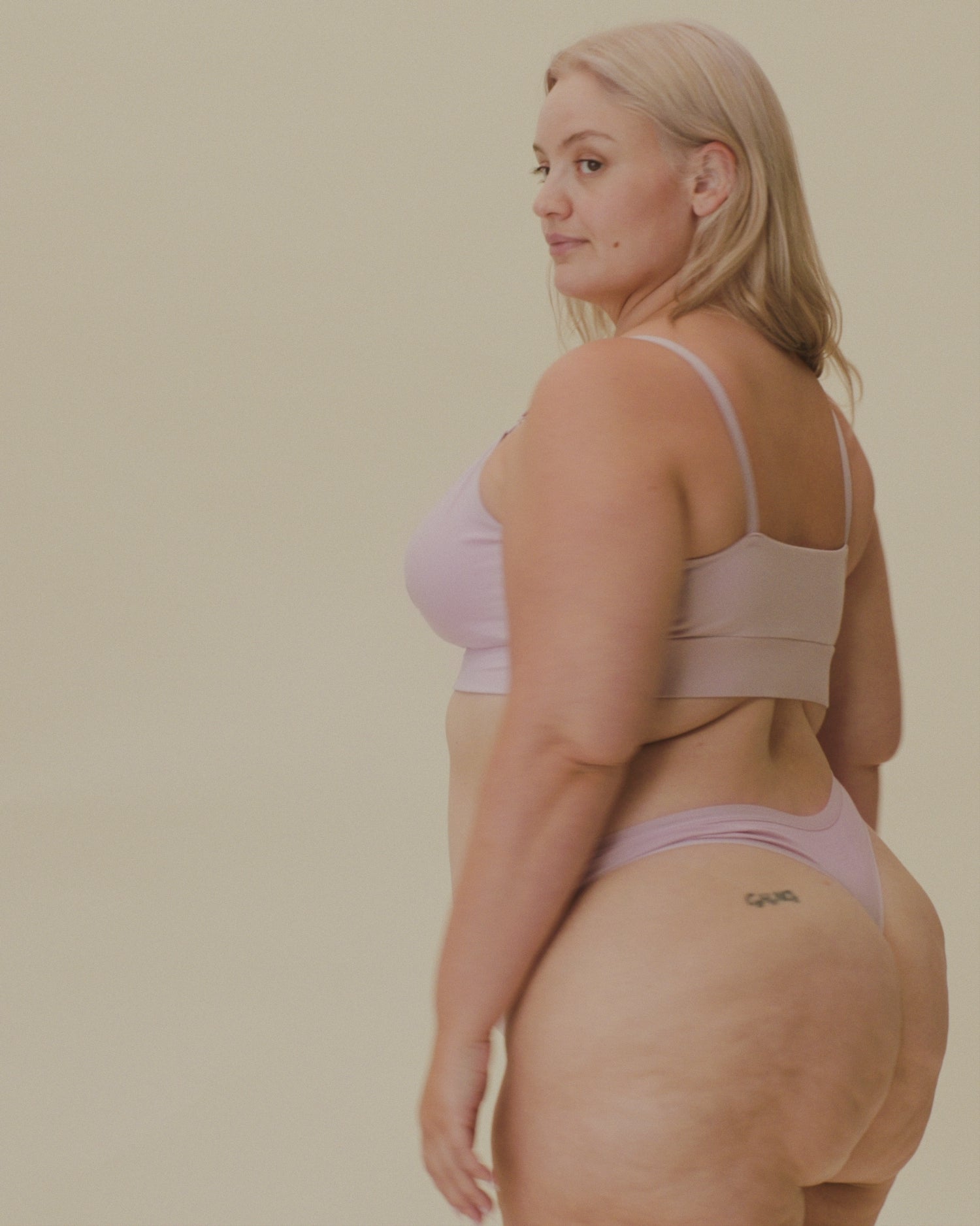 Video of model showing soft fit on the SoftStretch Cotton Nursing Bra in Lilac Mist and SoftStretch Cotton Maternity & Postpartum Thong in Lilac Mist on a beige background.