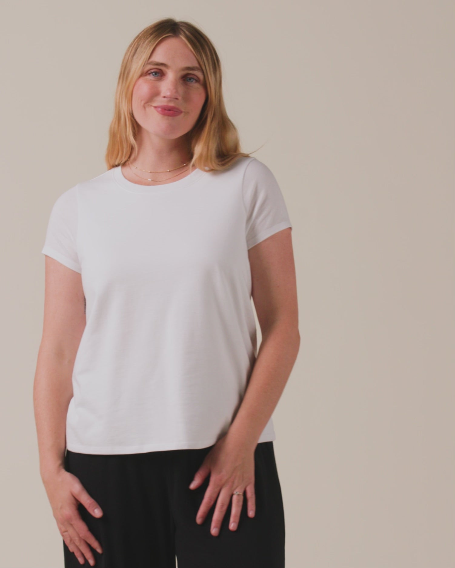Video of model wearing Classic Cotton Nursing T-shirt in White on a neutral background