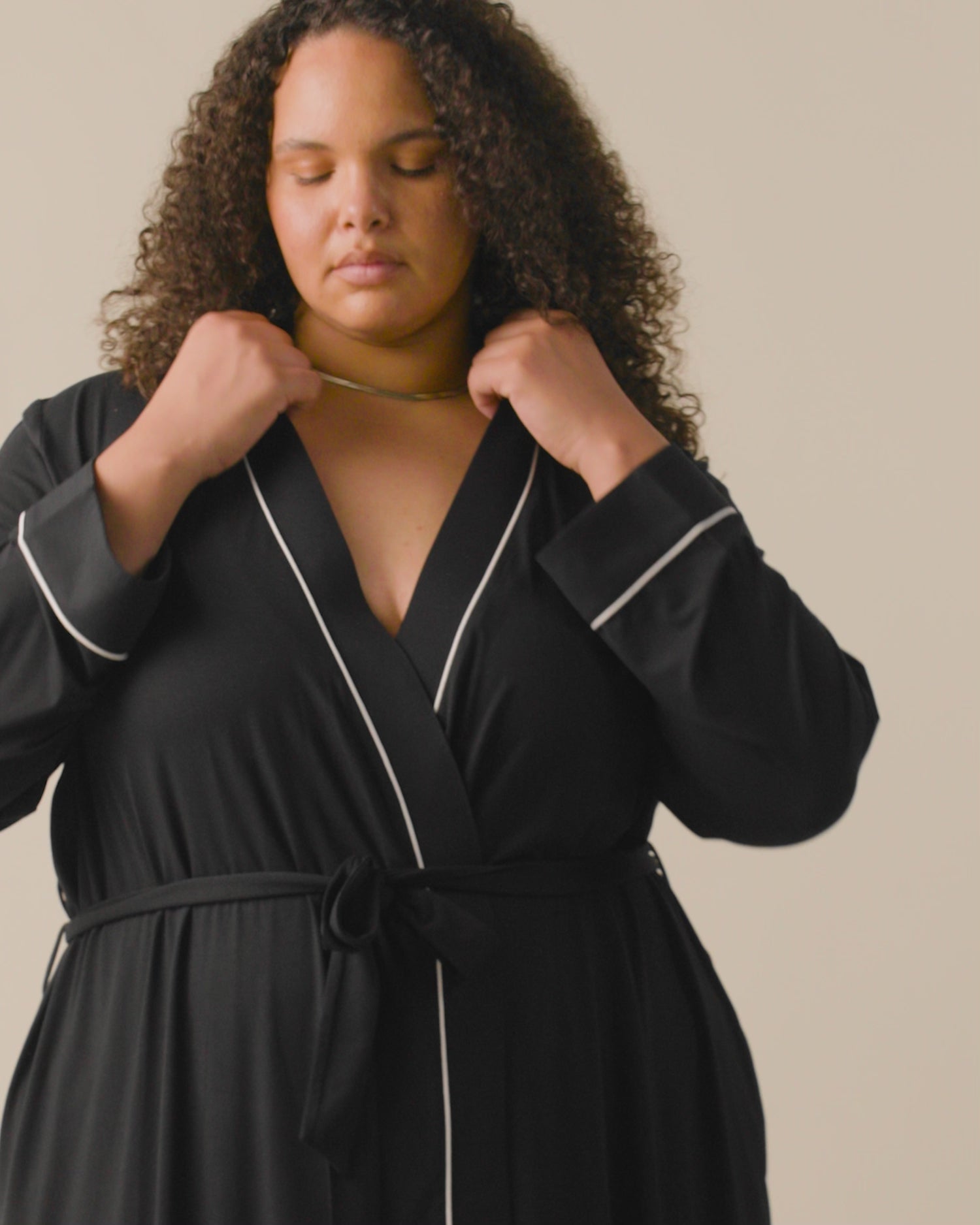 Video of model wearing Clea Bamboo Robe on a neutral background