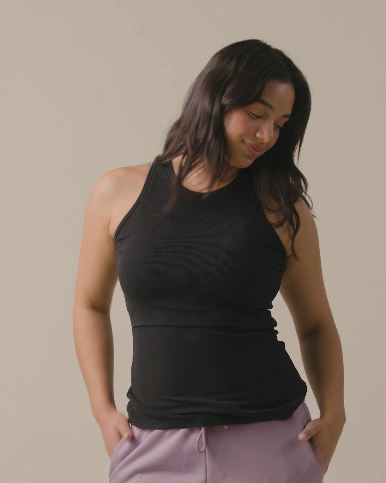 Video of model wearing Ribbed Bamboo Racerback Nursing Tank on a neutral background