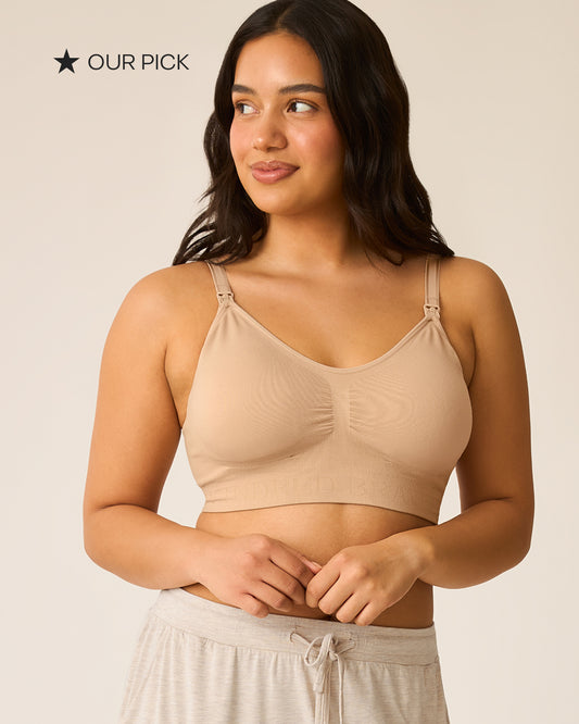 Black star and black text that reads: OUR PICK. Model is wearing Simply Sublime Nursing bra in Beige, on a beige background.