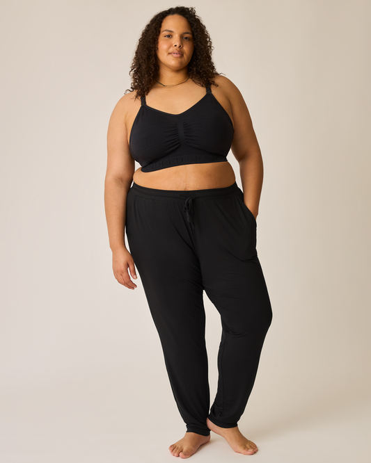 Woman wearing the Everyday Lounge Jogger in Black with matching bra@model_info:Ionna is 5'11" and wearing a 2X Long.