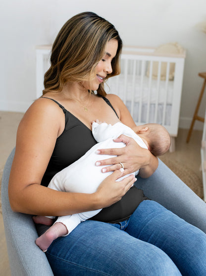 Model breastfeeding her child while wearing the Simply Sublime® Maternity & Nursing Tank in black