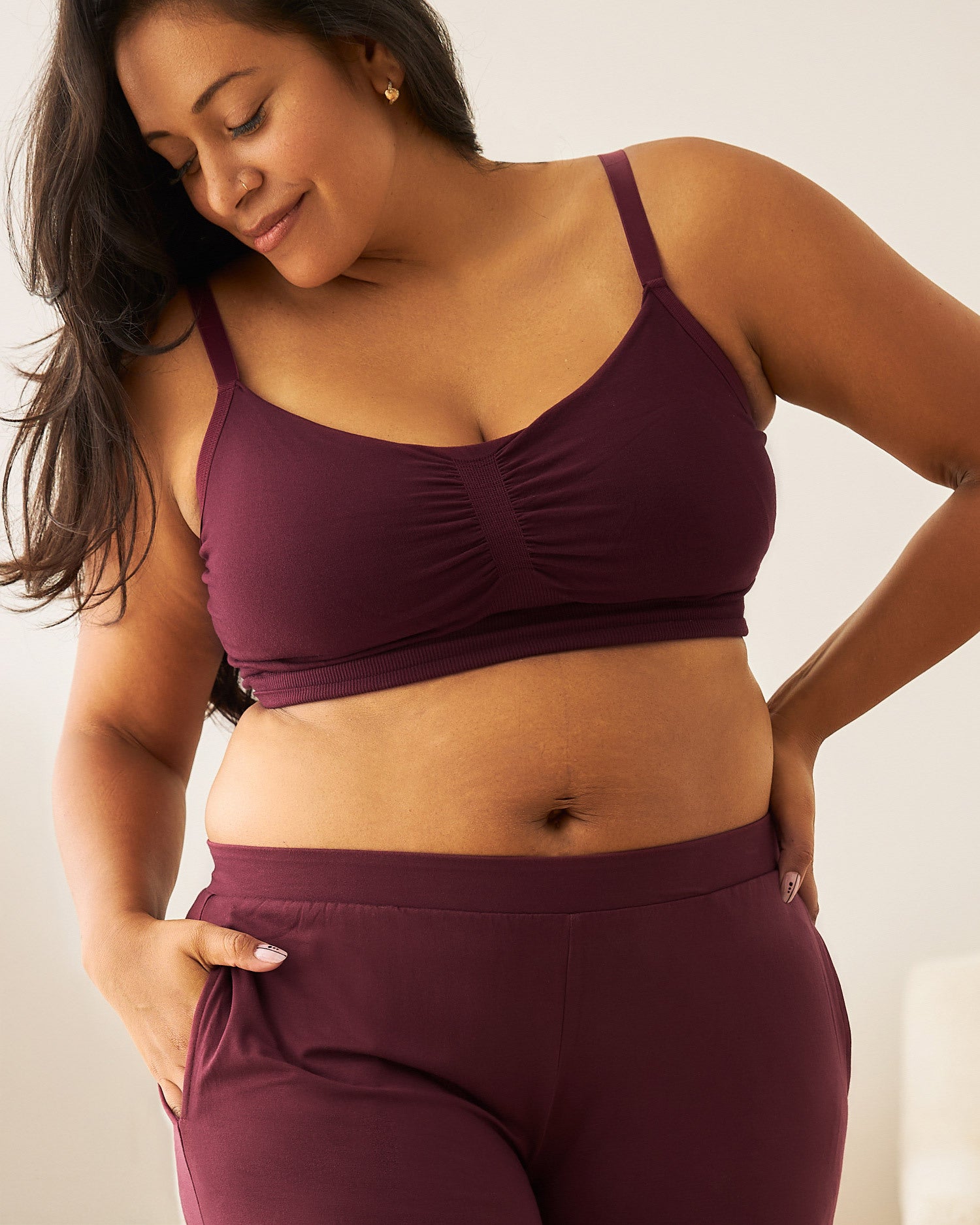 Woman wearing the Sublime® Bamboo Hands-Free Pumping Lounge & Sleep Bra in Deep Burgundy with matching pants @model_info:Lily is wearing a Large.