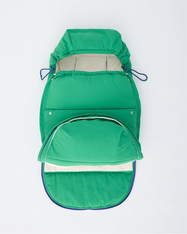 Cozy Stroller Footmuff in Green with foot  unzipped and open, on an off white background.