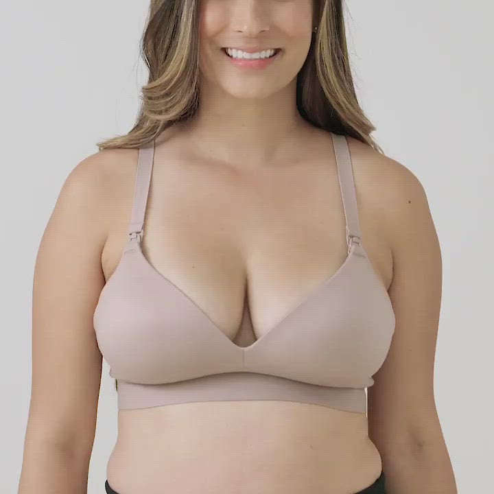Video showing a model wearing the Minimalist Hands-Free Pumping & Nursing Bra in Lilac stone as the model shows off the various aspects of the bra including the clip down nursing access. 